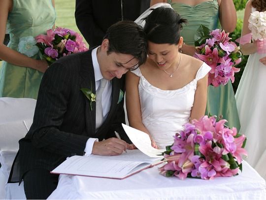 2018 02 14 22 22 51 bride and groom signing the book 2